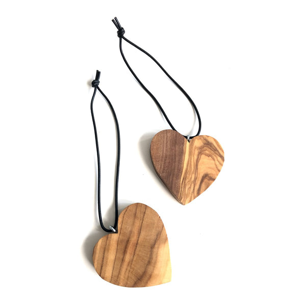 Air freshener hanging for the car as a heart of olive wood